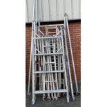 Aluminium scaffold tower comprising of eight 4 rung 'H' frames, 2 x outriggers, walk board,