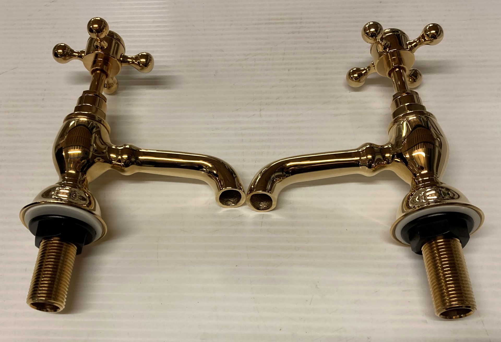 A pair of Imperial 1/2" basin taps in antique gold (saleroom location: R13)