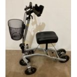 A Stride-On knee-walker mobility aid collapsible with 3 wheels to front and 2 to back (saleroom