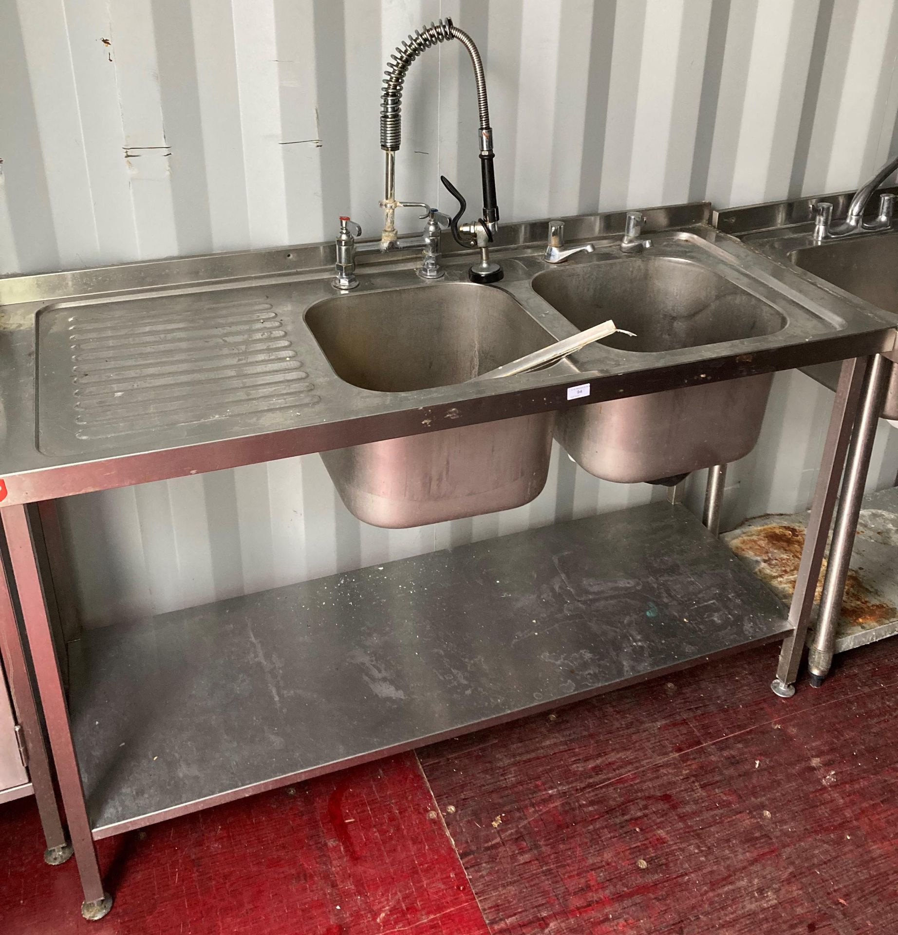 Stainless steel double sink unit with left-hand drainer and mixer top with under-shelf,