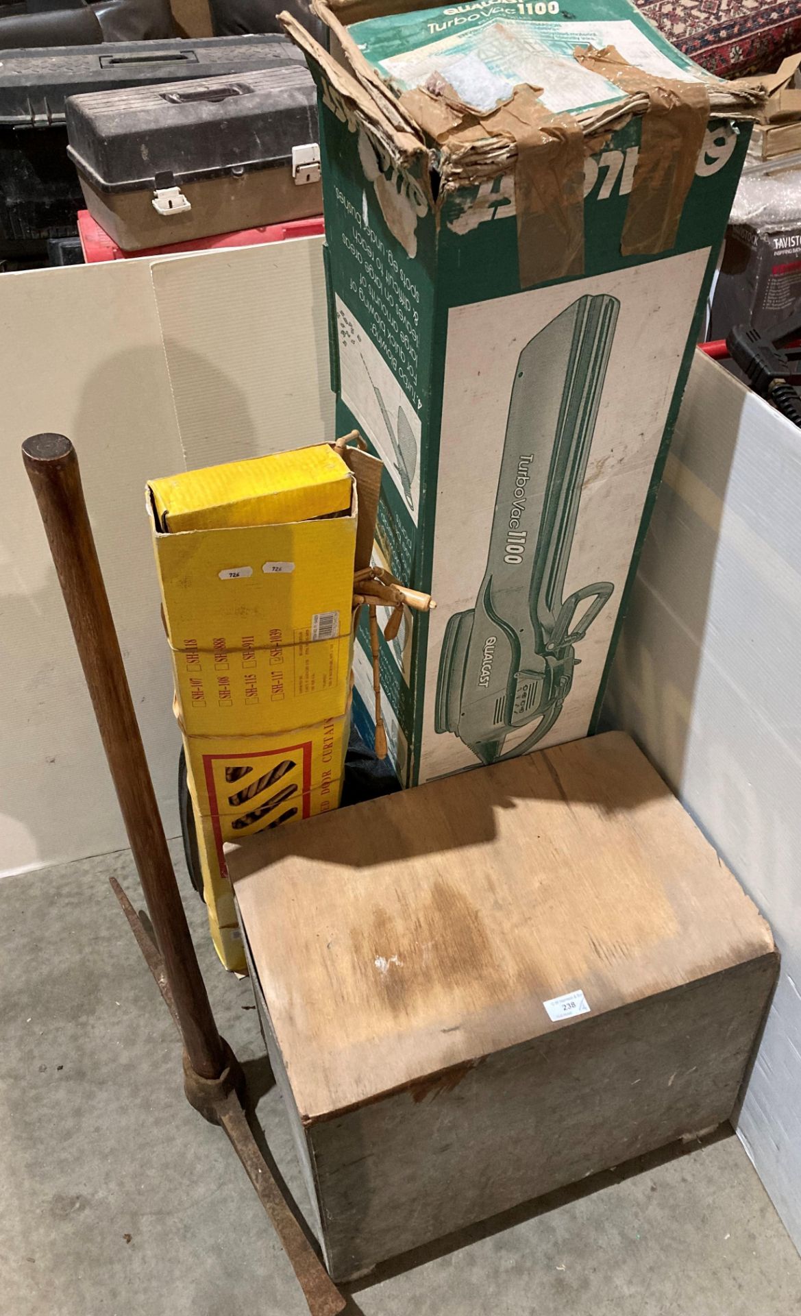 Wooden lift-top box with assorted hand tools and a Qualcast Turbo Vac 1100,