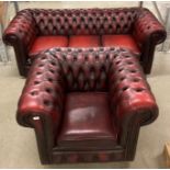 Red leather deep buttoned 3-seater Chesterfield sofa with matching armchair and studding to front