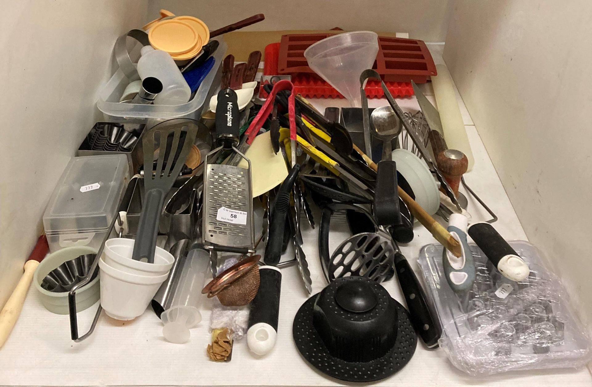 Contents to part of shelf - kitchen knives, tongs,