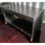 Mobile stainless steel kitchen preparation counter with 2 sliding door storage areas below,