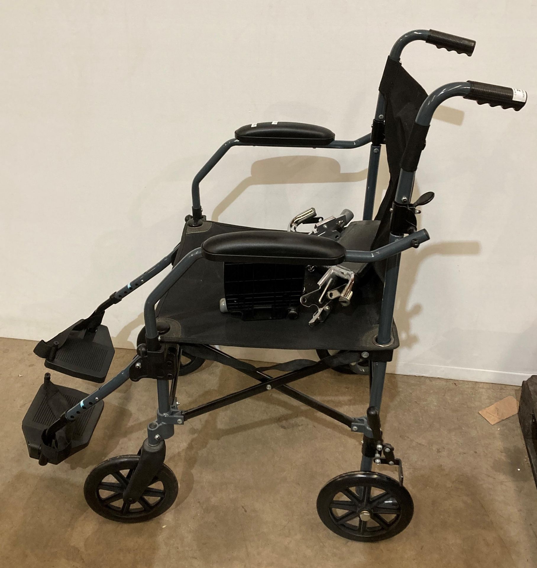 A Drive lightweight folding Travelite wheel-chair with foot rests (saleroom location: MA2/3)