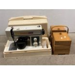 Toyota electric foot-operated sewing machine in carrying case - model: 222 - and a wooden