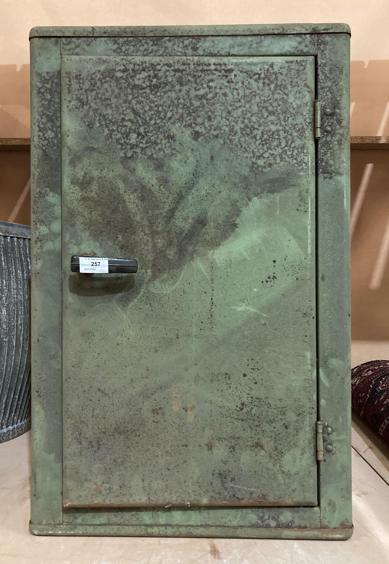 A vintage green metal engineer's single-door cabinet with 2 x adjustable shelves,