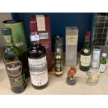 A small whisky collection comprising a 70cl bottle of Glenfiddich 12 years old Single Malt Scotch