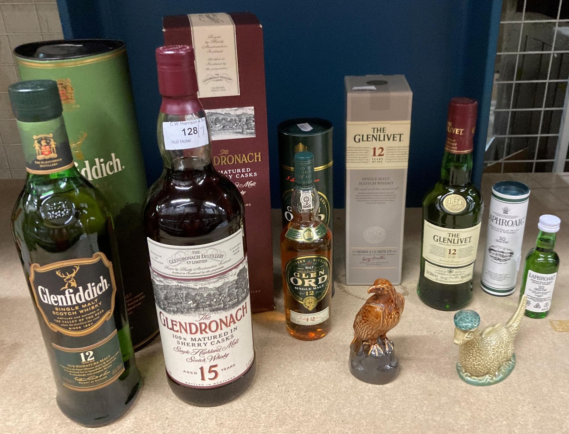 A small whisky collection comprising a 70cl bottle of Glenfiddich 12 years old Single Malt Scotch