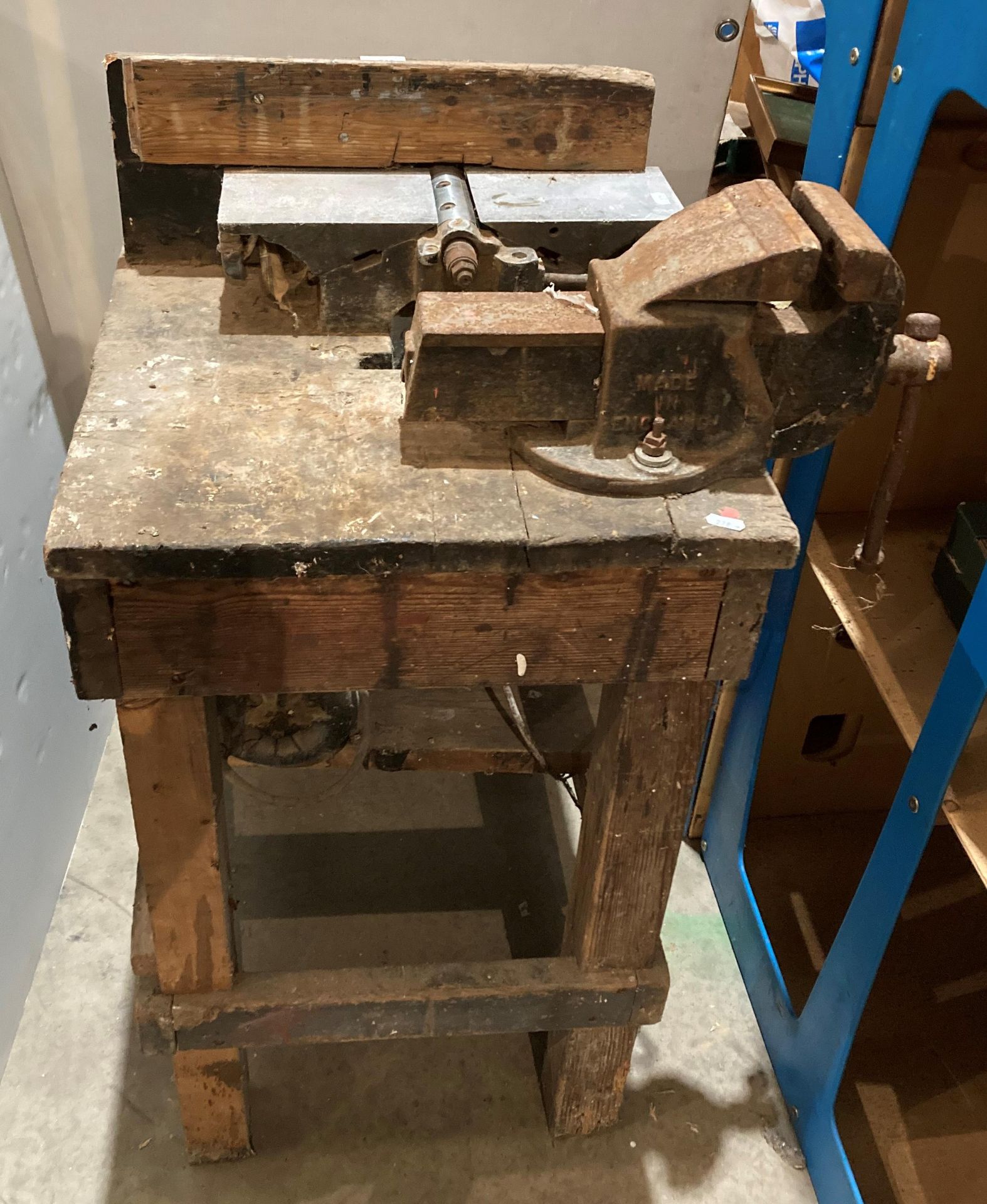 Vintage wooden joiners bench with a metal Record No 4 vice and a bench-mounted planer belt driven