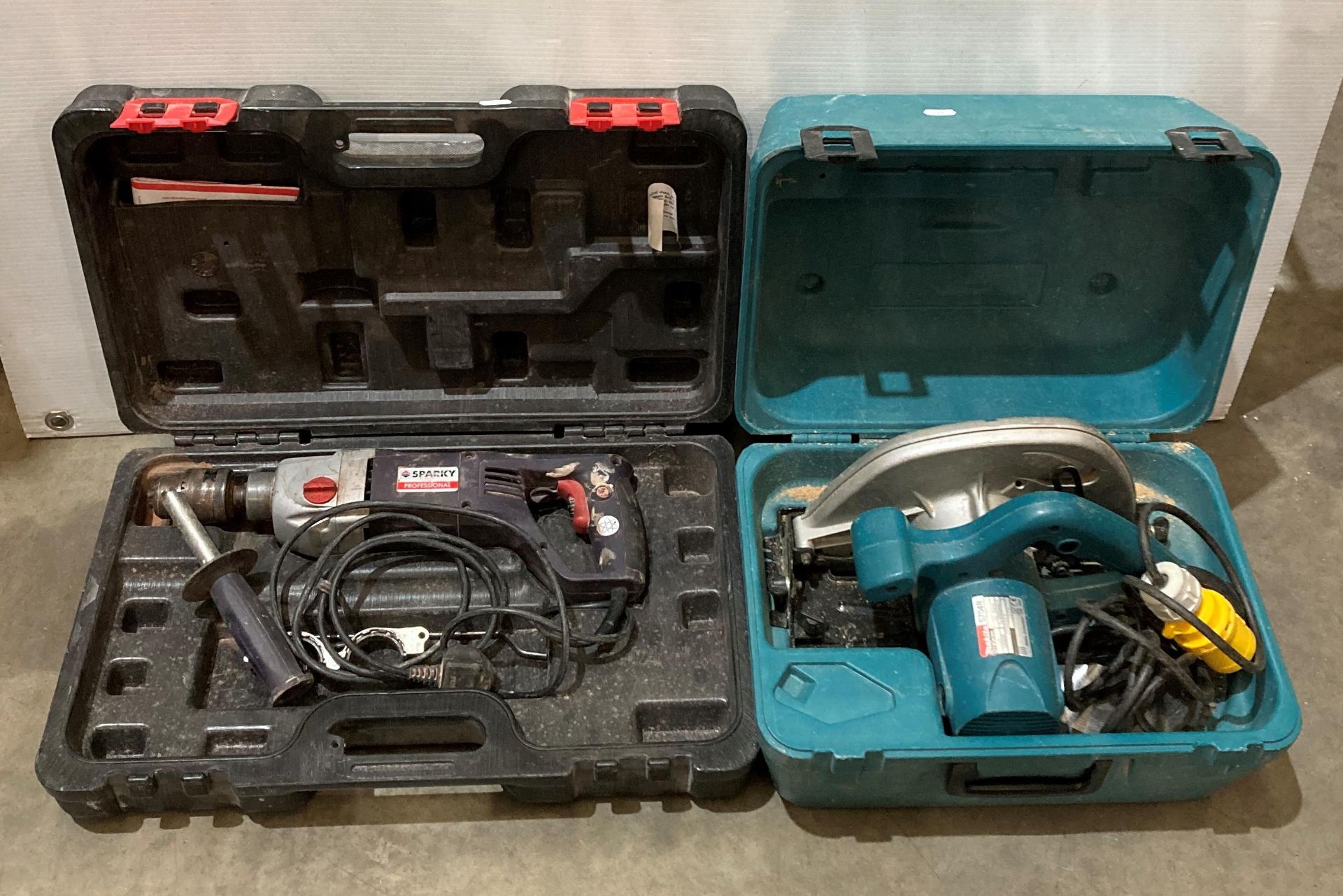 A Sparky Professional BUR2 350E (240v) hammer-drill in case and a Makita 5704R (110v) circular-saw