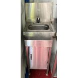 Small stainless steel wash hand single tap unit with cupboard below,