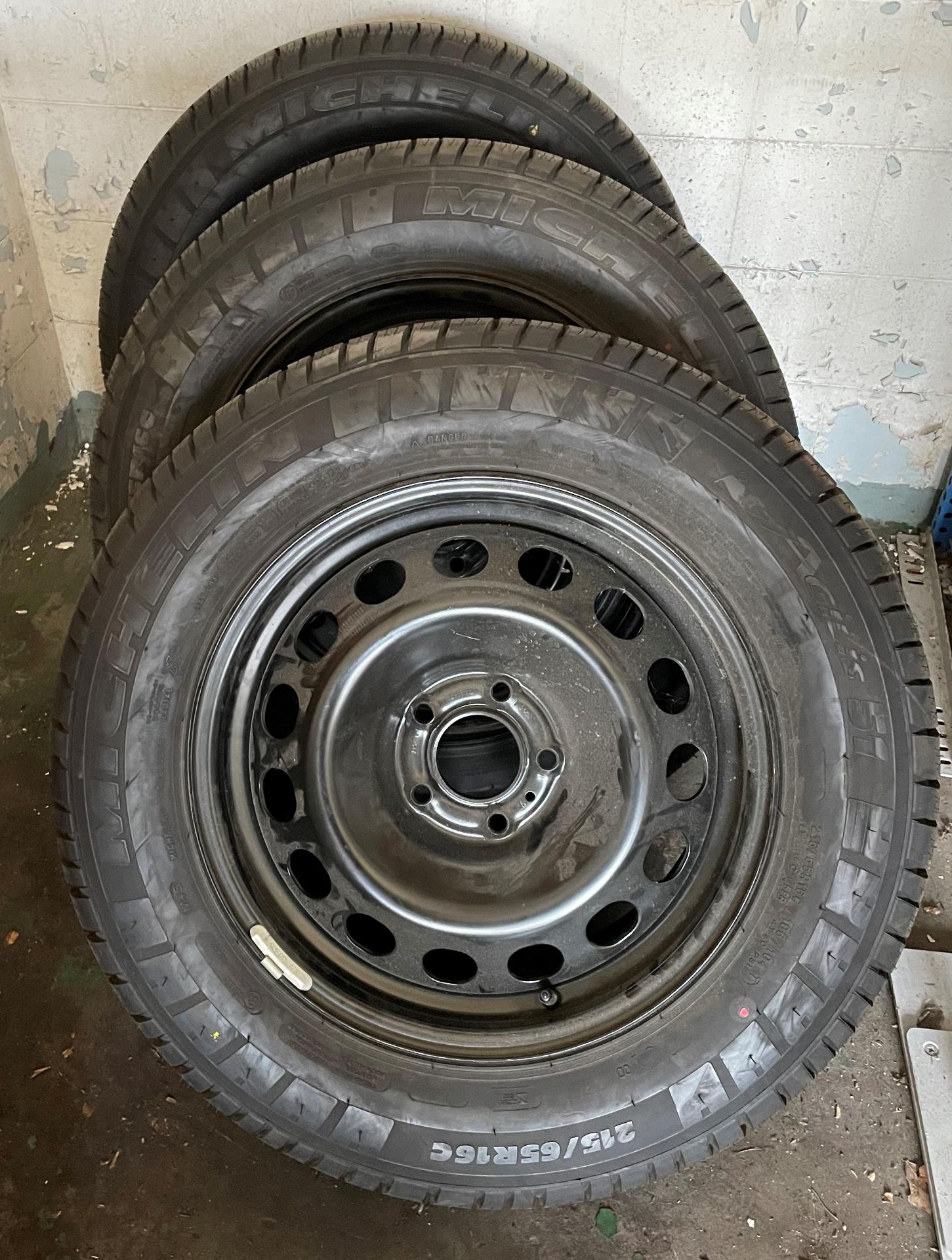 Set of three five stud black metal wheels with Michelin Agilis 51 215/65R16C tyres (possibly