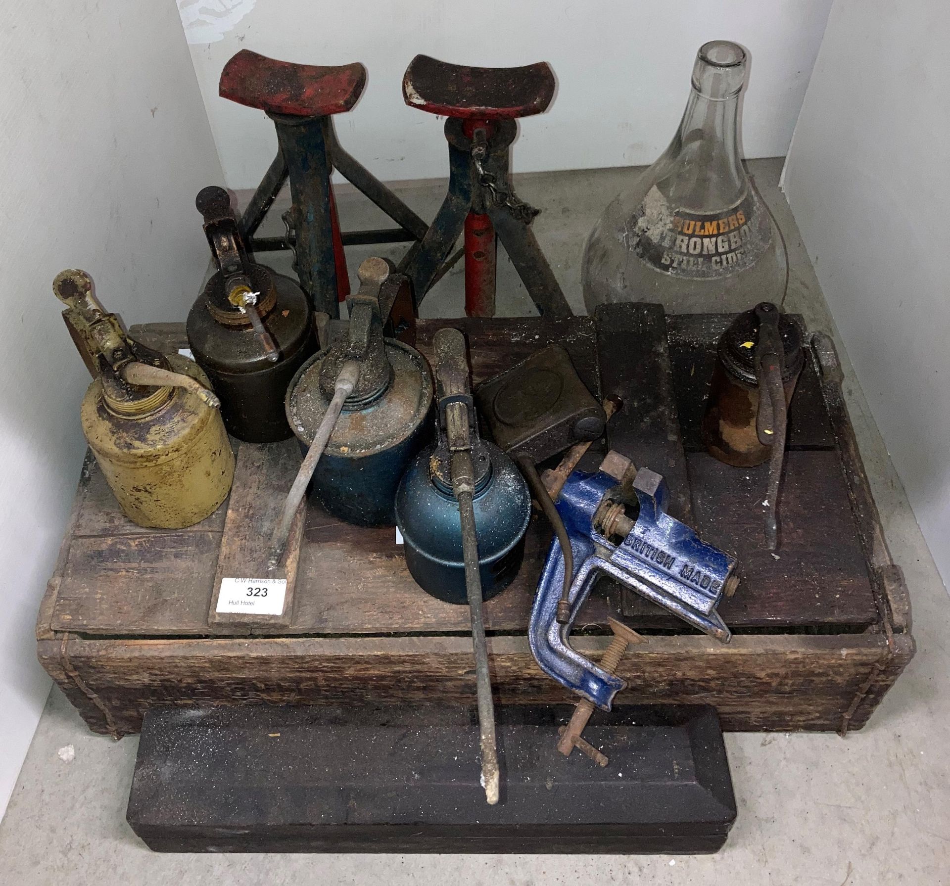 12 assorted items including a wooden vitamin Britvic box, six assorted oil can, table vice,