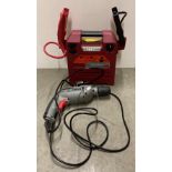 4-in-1 jump starter battery pack and a Wickes hammer-drill (240v) (saleroom location: R05-1)