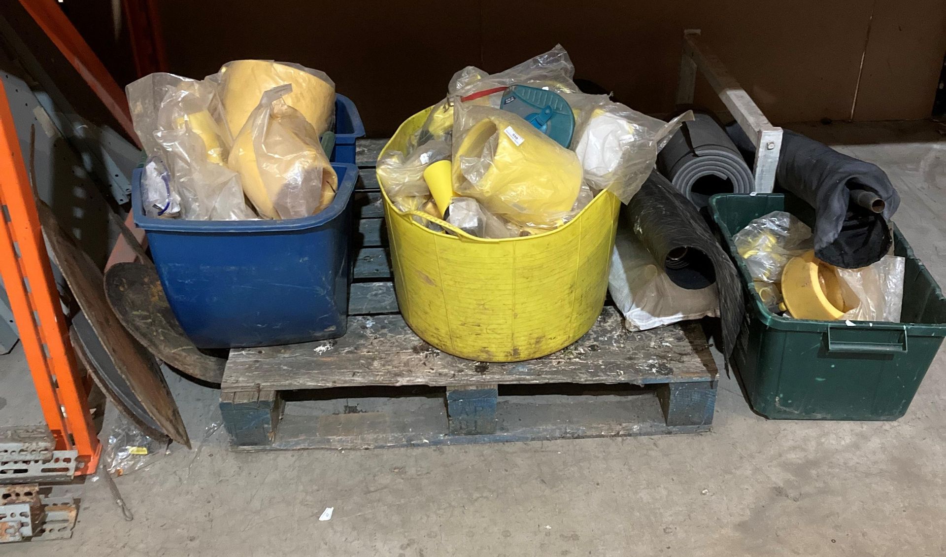 Contents to under-shelf area - yellow plastic pipe fittings, tape measure,