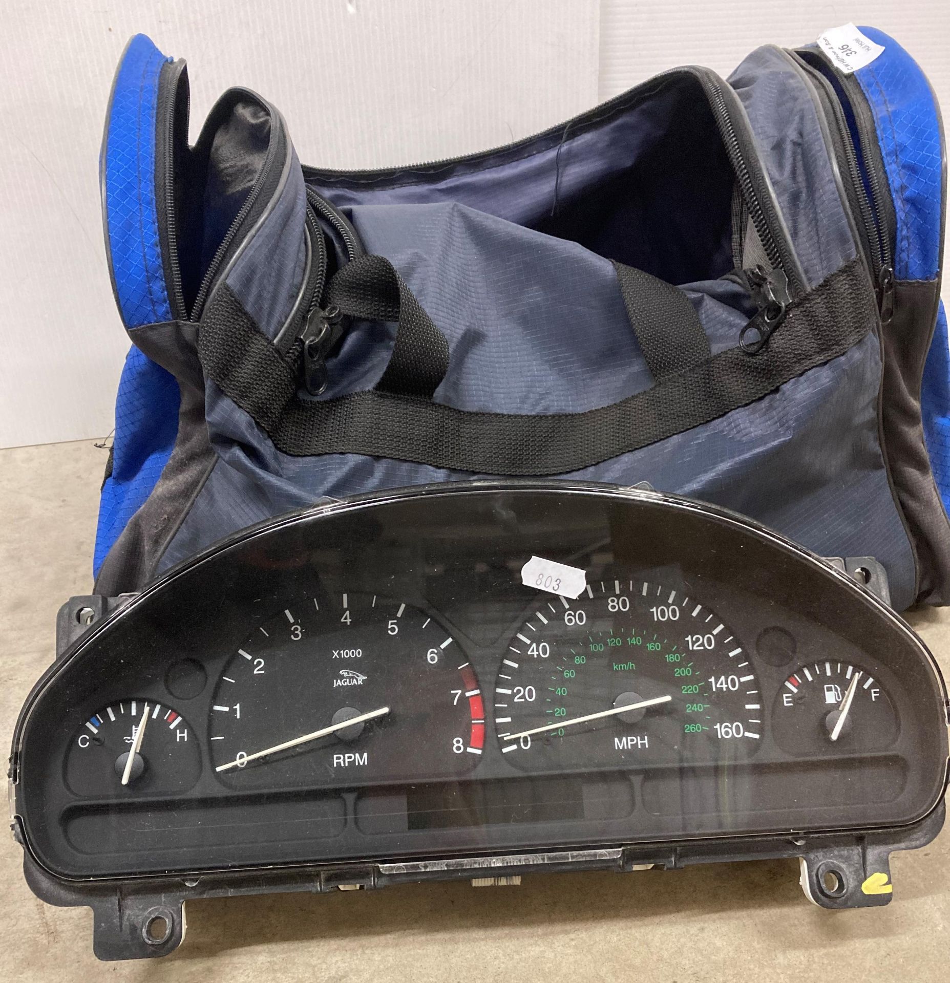 Jaguar 1999 instrument cluster and a blue fabric bag (saleroom location: S05-2) - Image 2 of 2