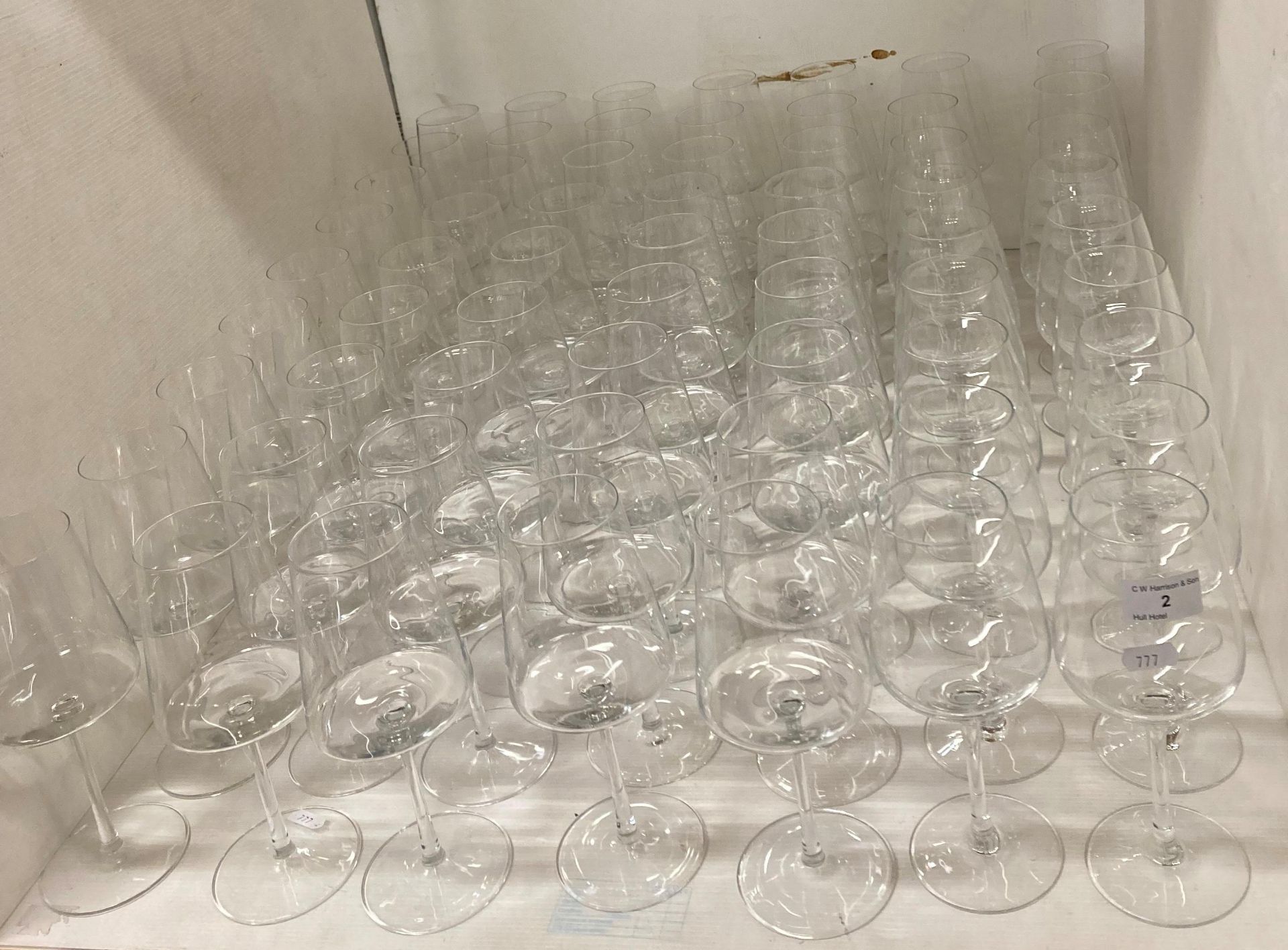 63 x Single stemmed plain glass wine/cocktail glasses,