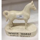 A cream ceramic horse advertising White Horse Scotch Whisky 22cm long x 23cm high (saleroom