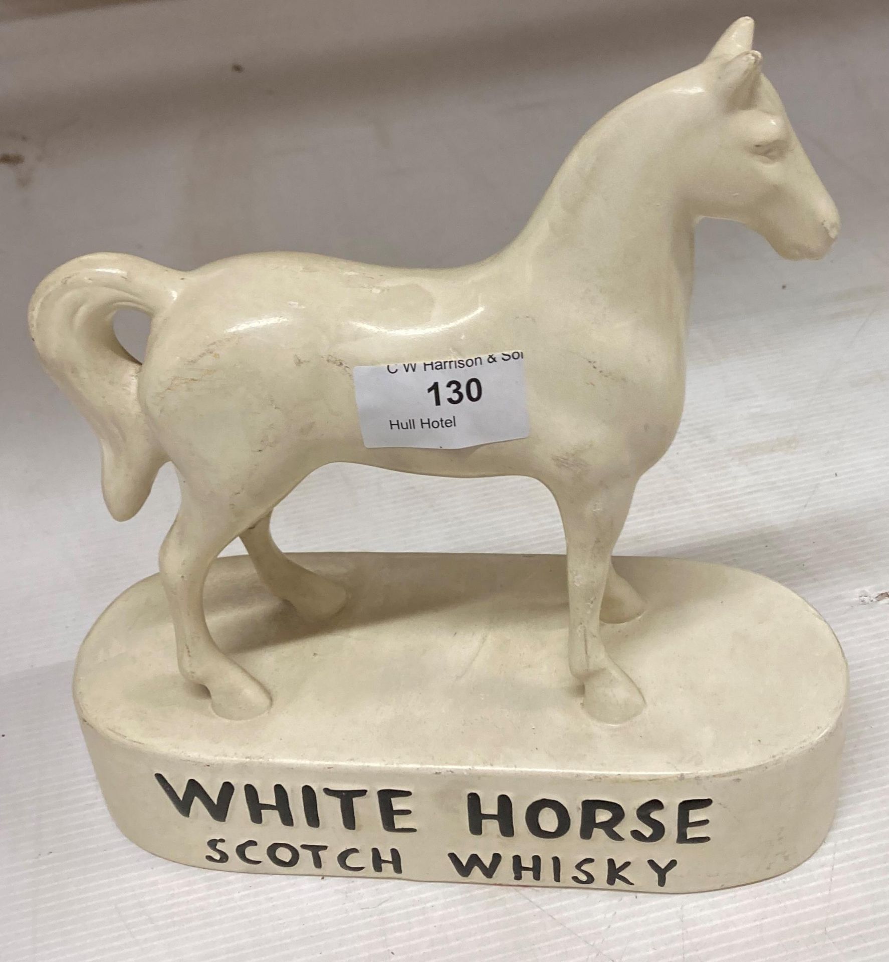 A cream ceramic horse advertising White Horse Scotch Whisky 22cm long x 23cm high (saleroom