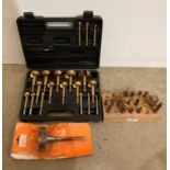 A cased set of 19 Mastergrip titanium-plated forstner bits and a 16-piece router set in black
