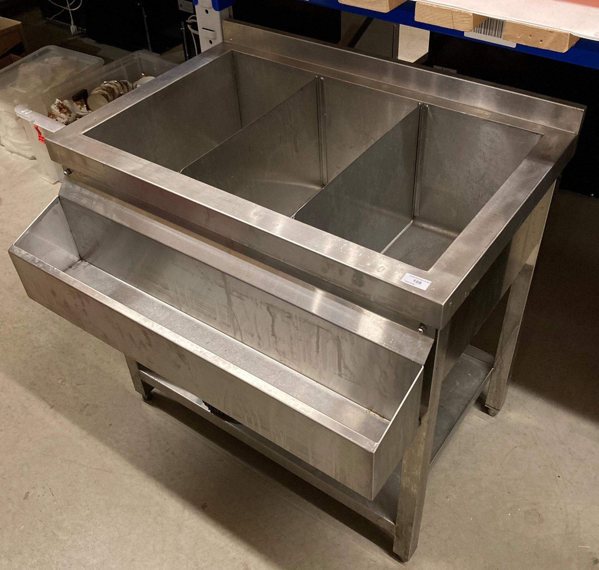 3 compartment stainless steel ice storage unit with internal dividers and drip tray,