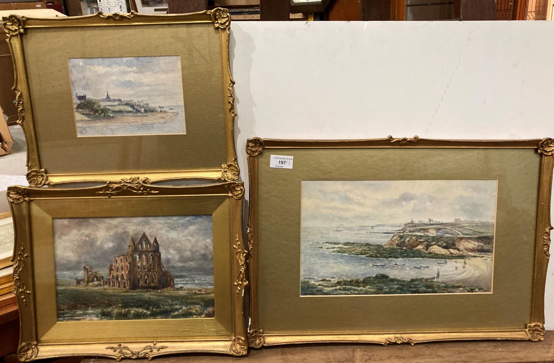 Three unsigned gilt framed watercolours 'Fishermen on the Foreshore with Whitby in the Background'