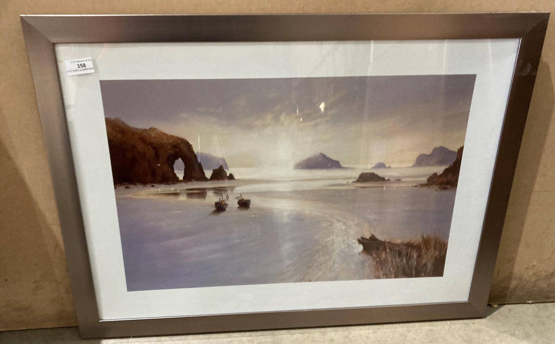 Framed print, fishing boats on the shore with a bay in the background,