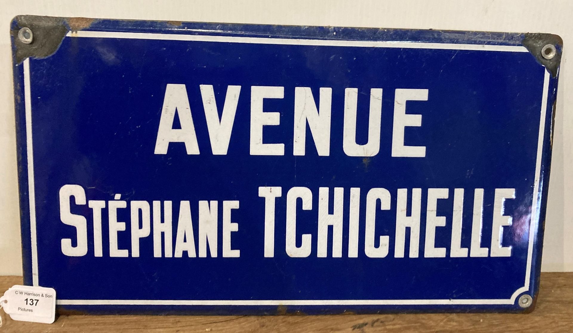 Blue and white painted enamel street sign, Avenue Stephane Tchichelle,