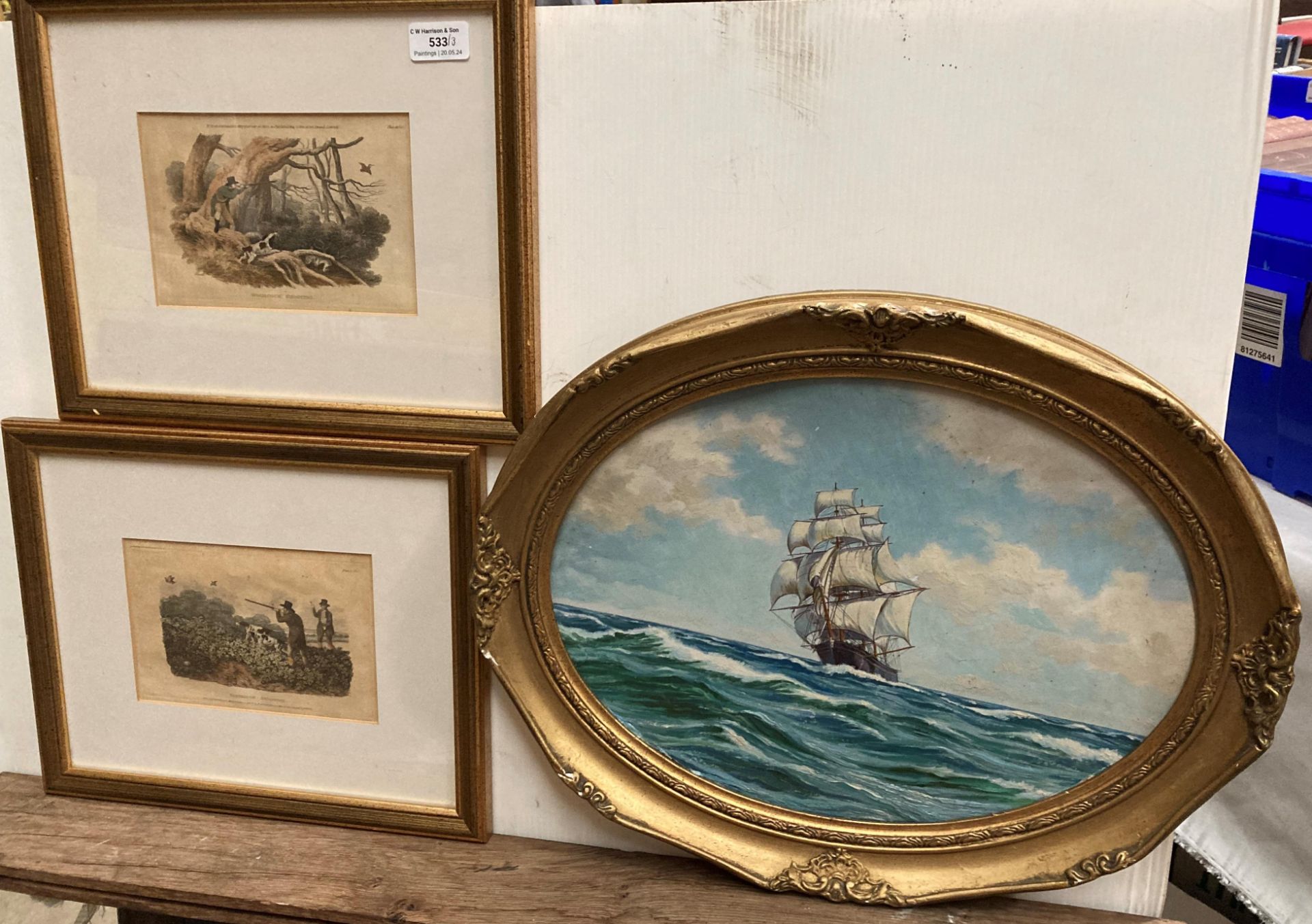 An oil of a seascape on board in gilt oval frame 30cm x 38cm and a pair of 19th Century engravings