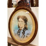 A pastel picture of the head and shoulders of an Edwardian lady in walnut oval frame,