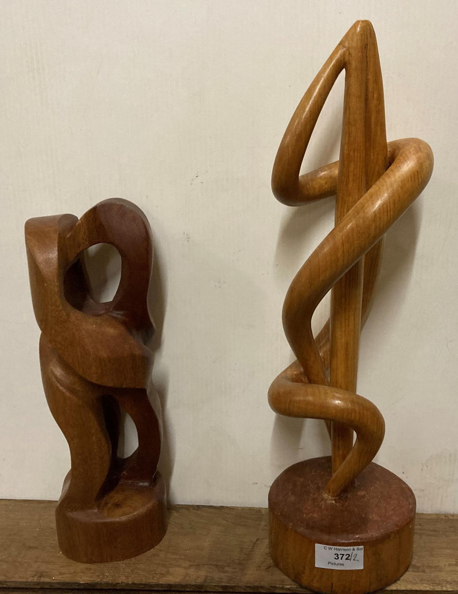 Two modern wood sculptures, one 46cm high,