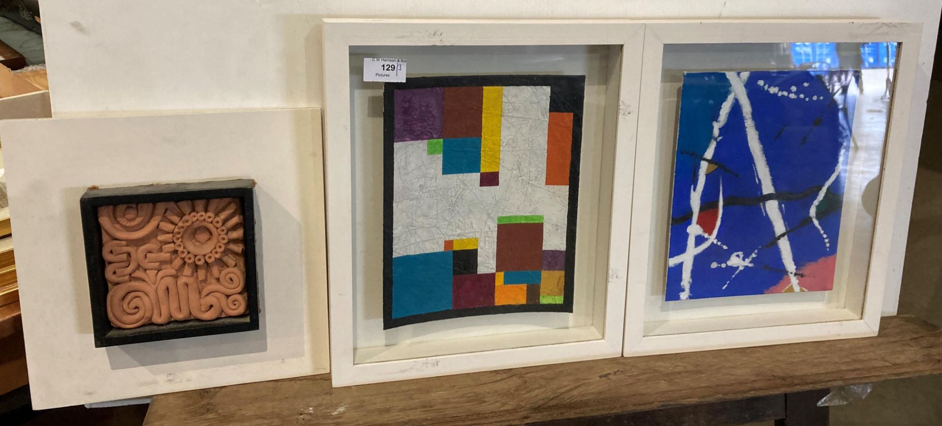 Three items, framed clay model by Norman Eastwood, 14cm x 14cm,