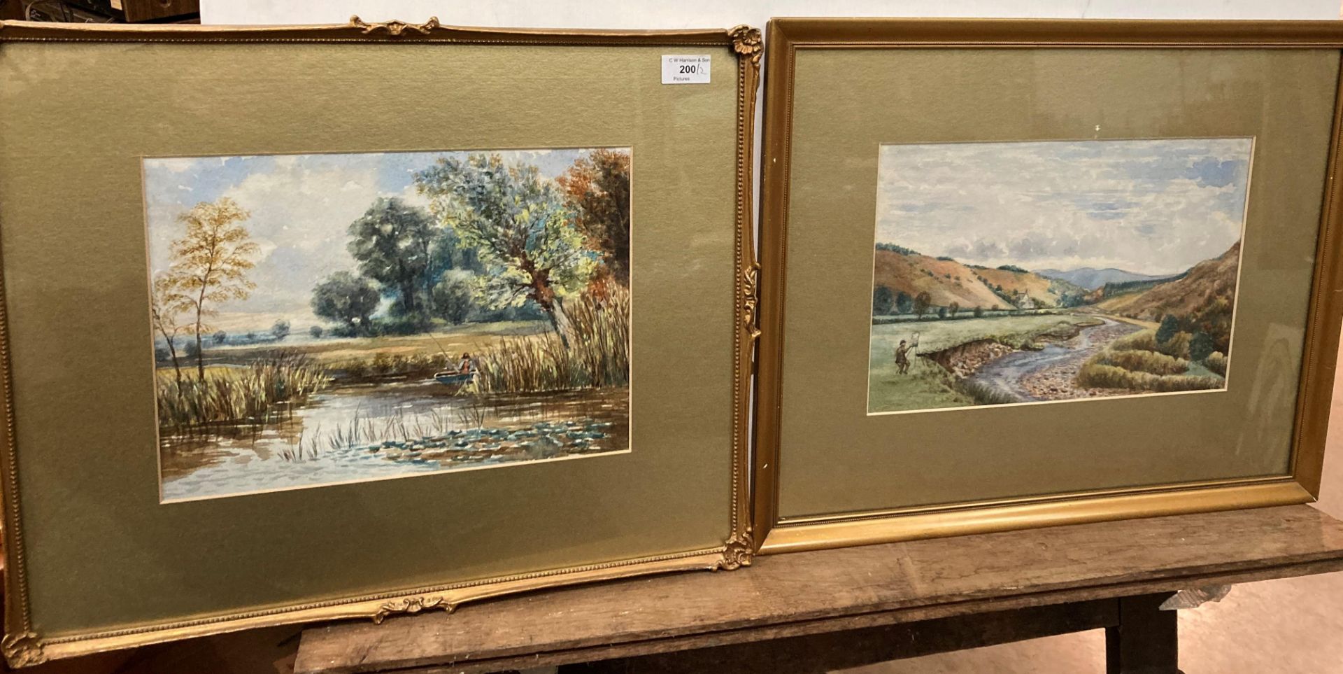 Unsigned two gilt framed watercolours set in the countryside,