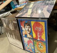 Three framed Beatles poster prints including 'Live at the BBC' and 'Abbey Road',
