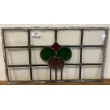 Three leaded and stained glass window sections, two 32cm x 54cm,