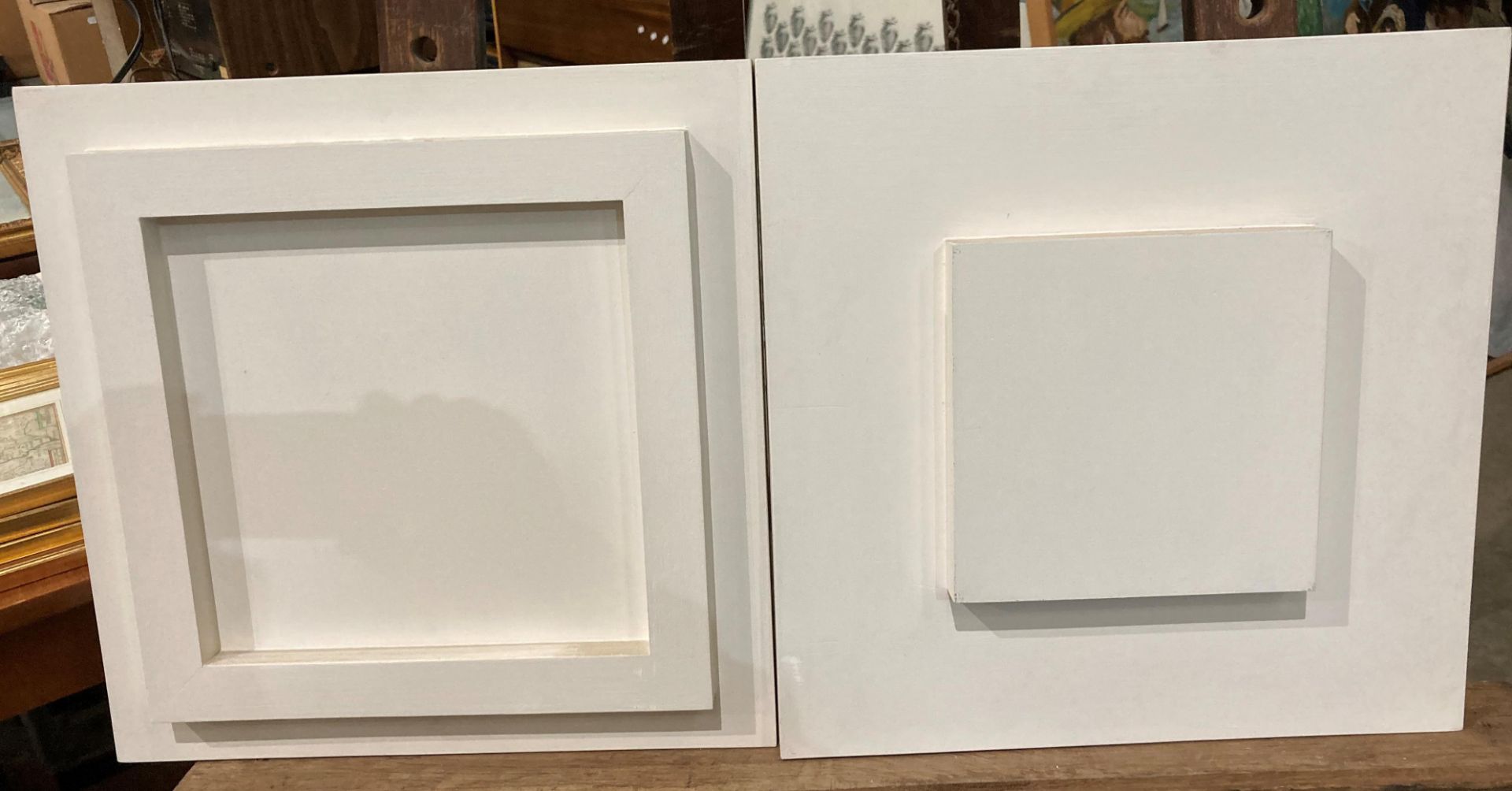 Two white painted block pictures,