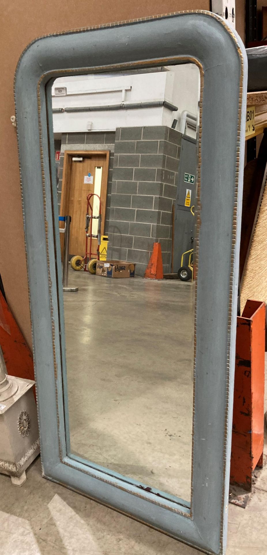 A large wall mirror with grey painted and gilt bevelled edge frame,