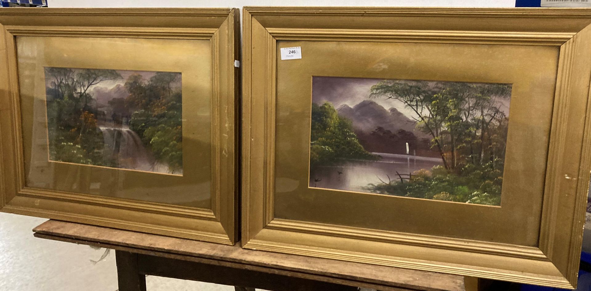 A pair of gilt framed watercolours - 'Oriental Waterfall' and 'Oriental Lake',
