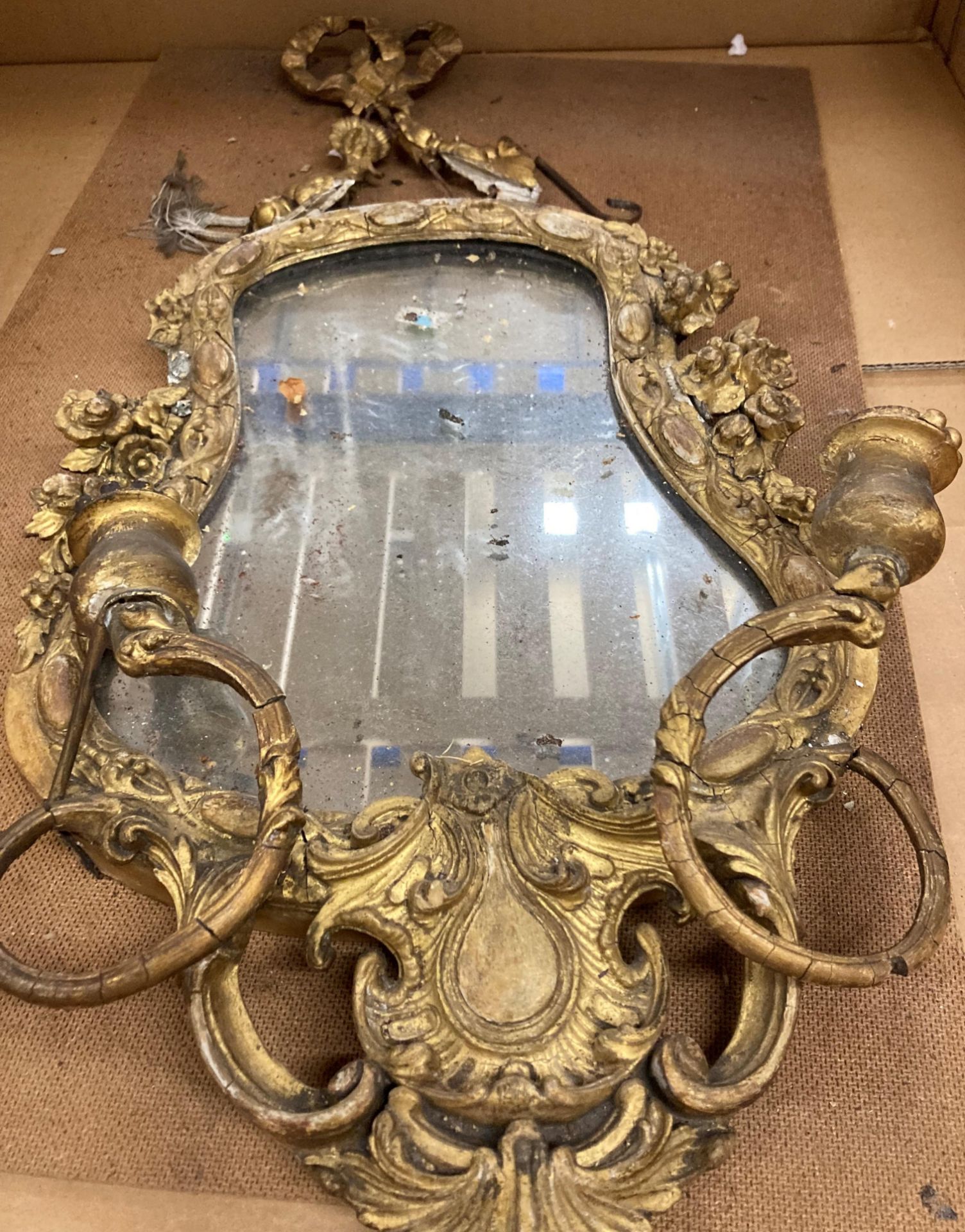 A 19th Century ornate gilt framed wall mirror - with damages - approximately 57cm x 34cm (sold as - Image 3 of 3