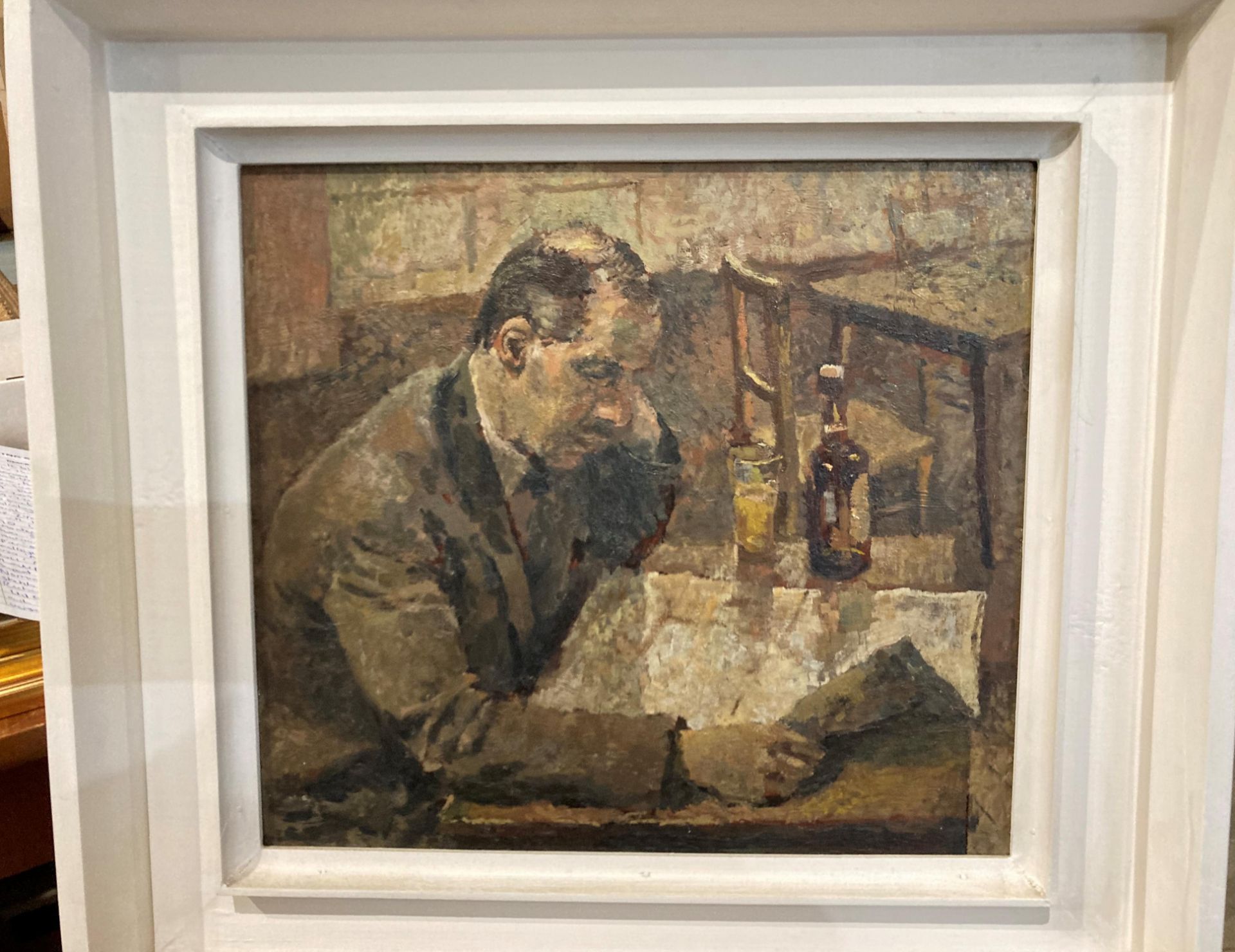 Unsigned, framed oil on board 'Man reading a newspaper in a pub',