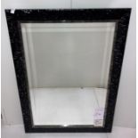 Large rectangular wall mirror with bevelled edge in dark ribbed-effect frame,