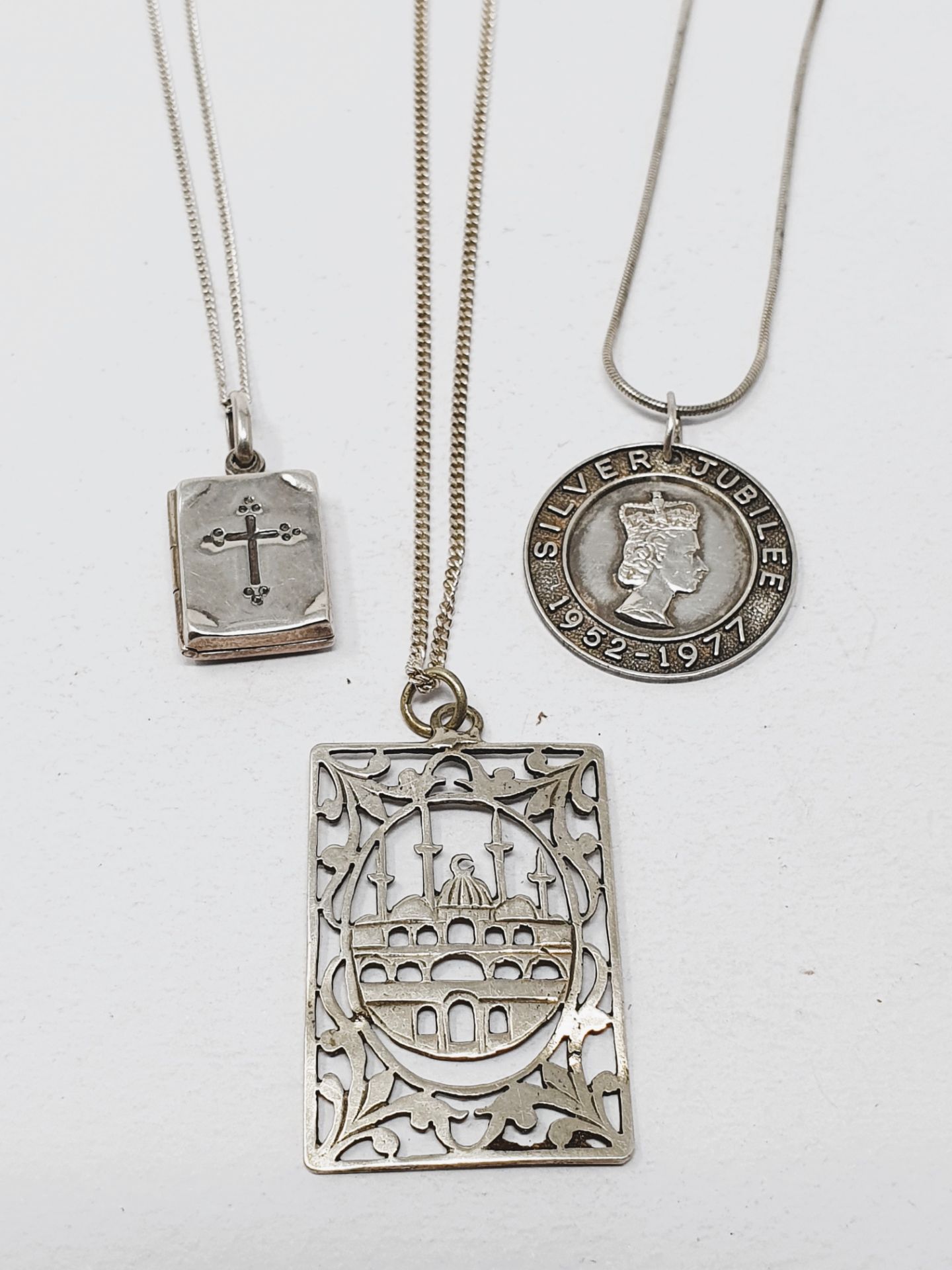 Sterling silver, three pendants with chains and four crosses with chains, gross weight 42. - Image 2 of 2