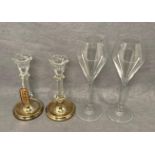 A pair of silver hallmarked base crystal candlestick holders by Whitehall (116cm high) both with