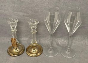 A pair of silver hallmarked base crystal candlestick holders by Whitehall (116cm high) both with