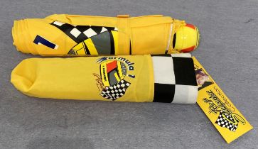 A Ralf Schumacher Formula 1 umbrella with helmet handle and outer cover (saleroom location: S3