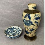 A vintage Chinese vase with blue and white bird and butterfly design on cracked glazed vase (22cm