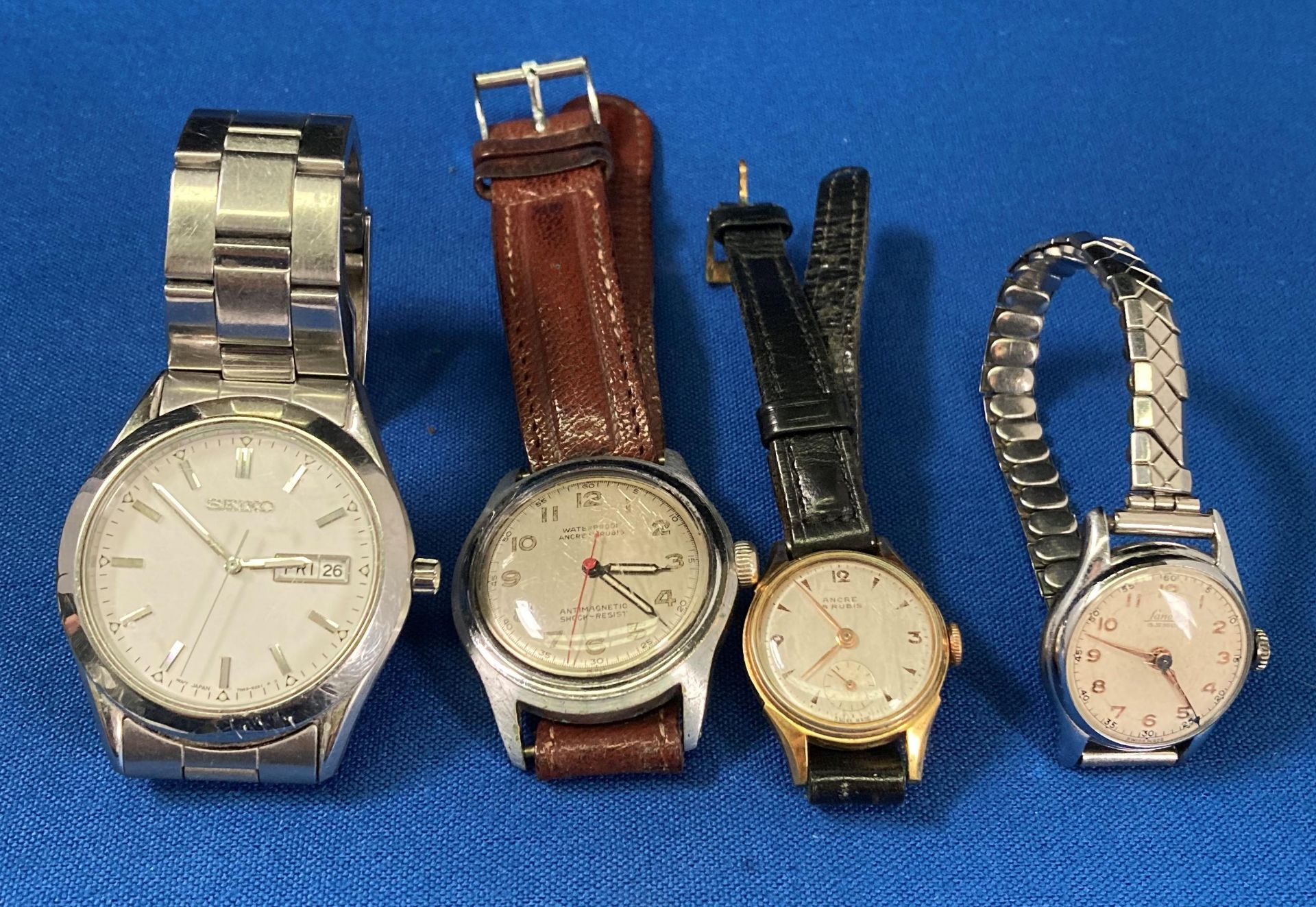 Four watches including an Ancre 15 Rubis gold/gold-plated watch (not tested - no visible hallmark)