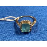 9ct gold ring with diamonds and a central light-blue stone (possibly aquamarine) size 'S'. Weight 3.