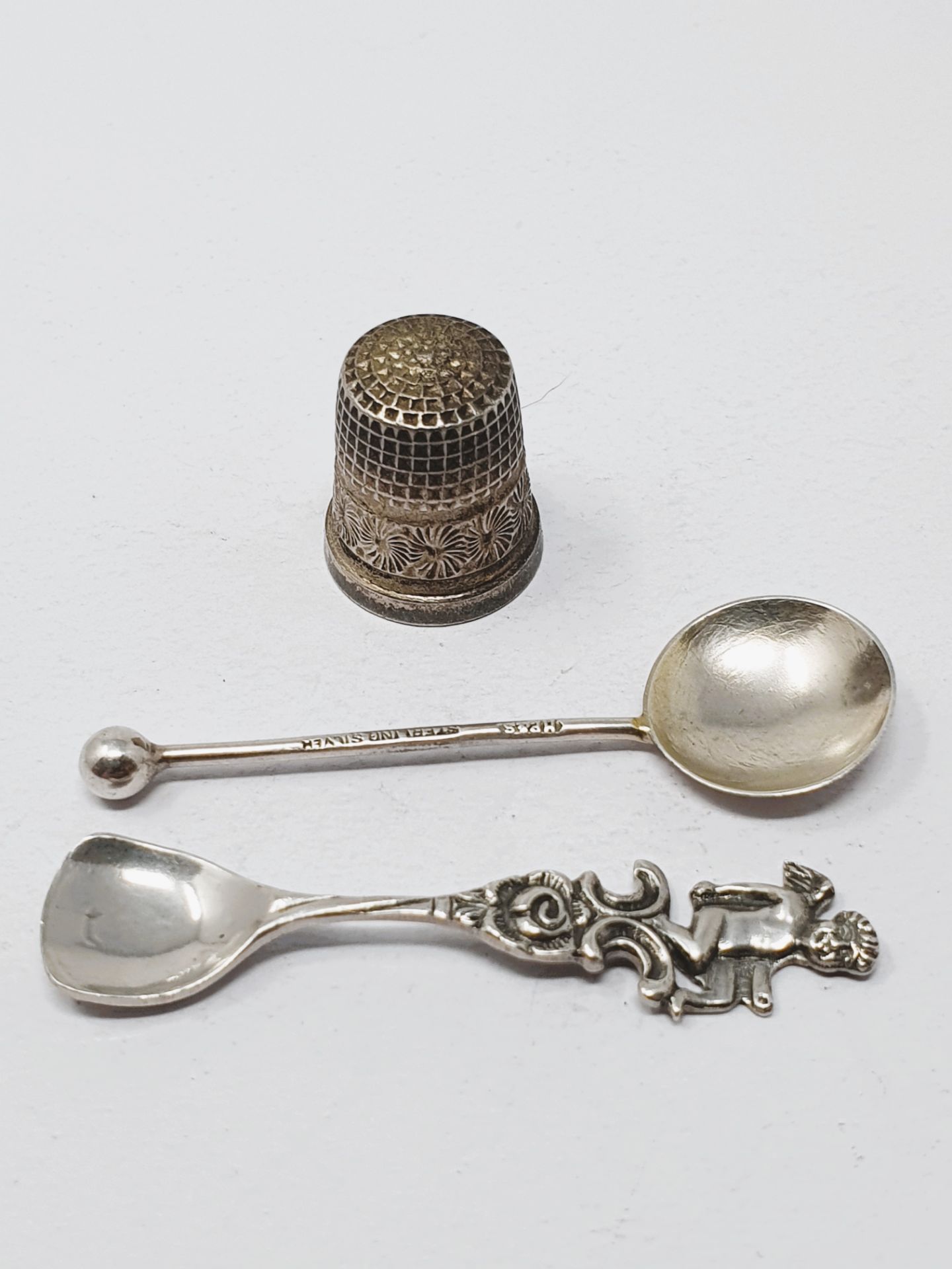 Sterling silver, three bookmarks, a thimble and two condiment spoons, gross weight 27. - Image 2 of 2